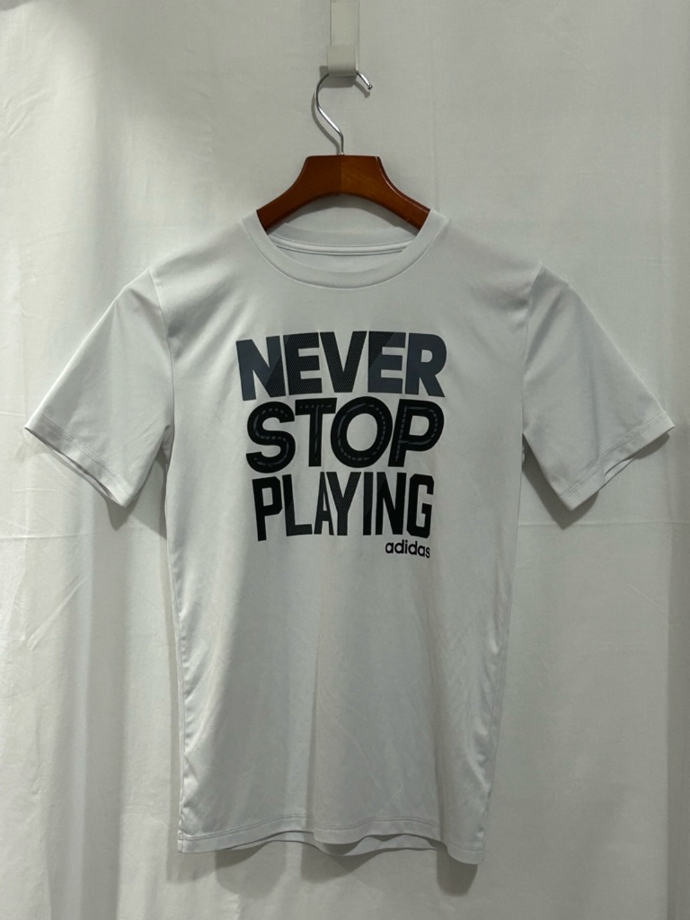 Adidas - White Tee with Black 'Never Stop Playing' Graphic